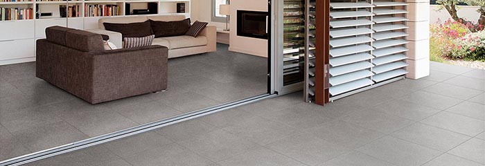 Carrelage : pierre naturelle ou béton ciré ?